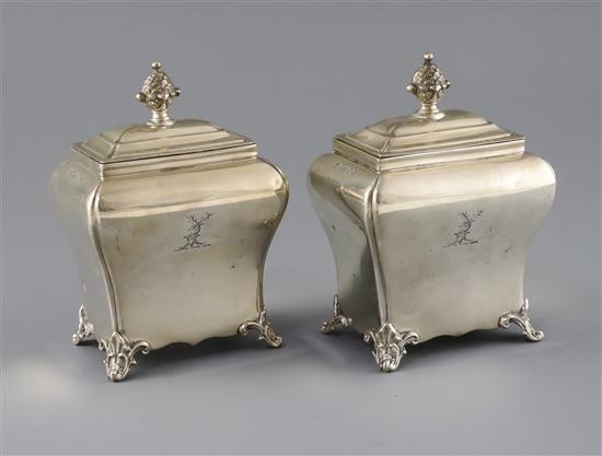 A pair of Victorian silver bombe shaped tea caddies by Henry Wilkinson & Co, 17.5 oz.